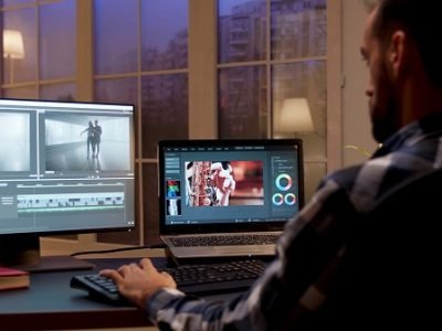 back-view-content-creator-working-home-office-during-night-time-video-editor-home-office.jpg