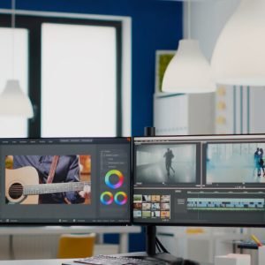empty-modern-creative-agency-office-with-dual-monitors-setup-with-processing-video-film-montage-vide