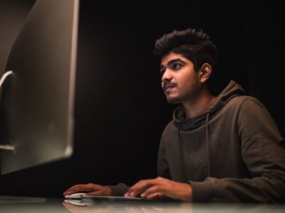 indian-man-hacker-using-computers-stealing-data-desk